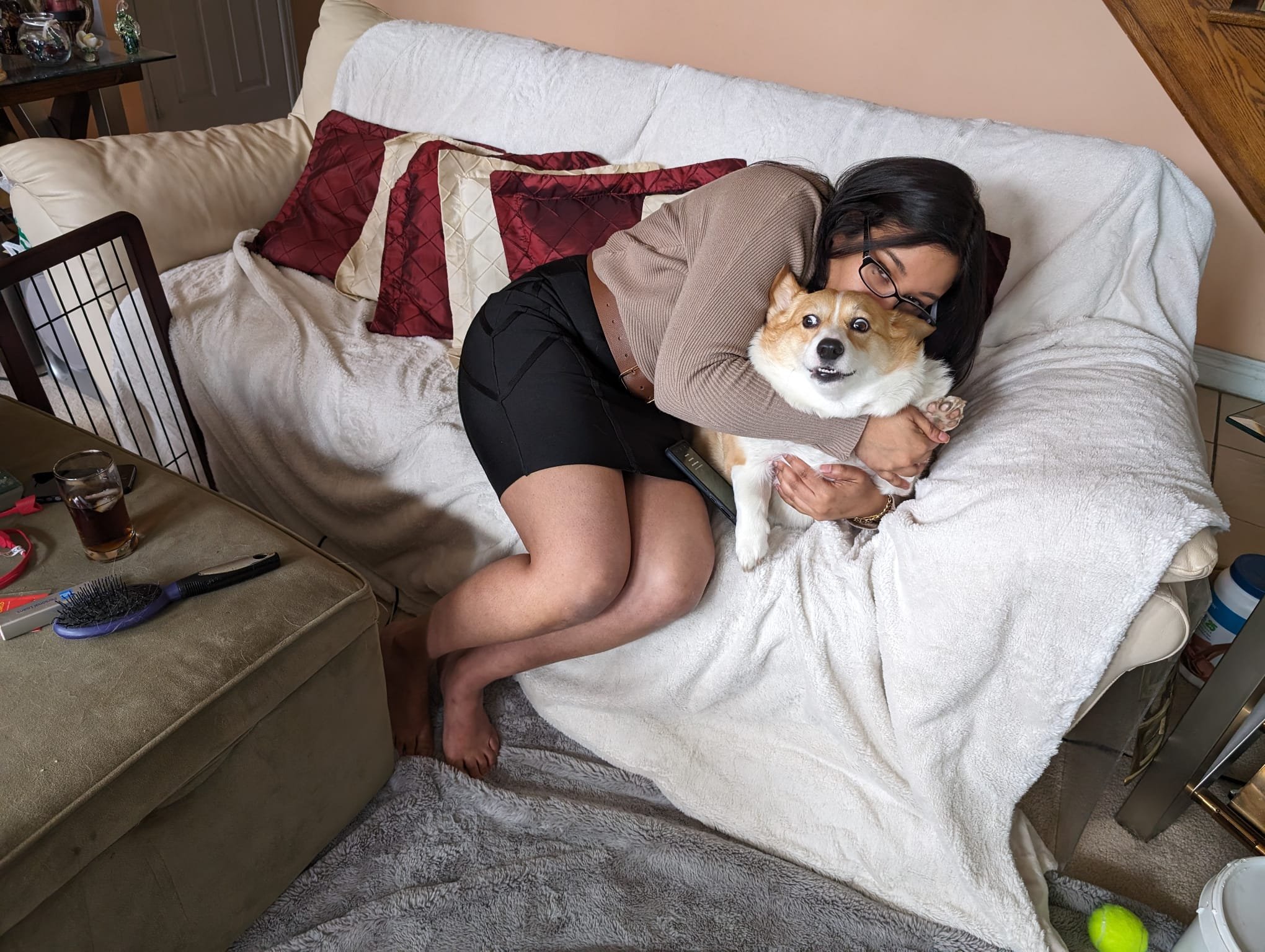 Mia being hugged on the couch